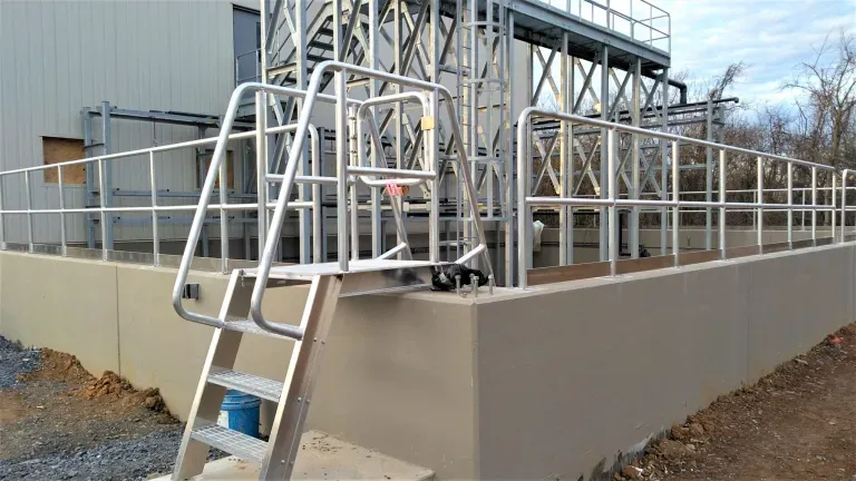 Industrial outdoor staircase with metal railings and platform