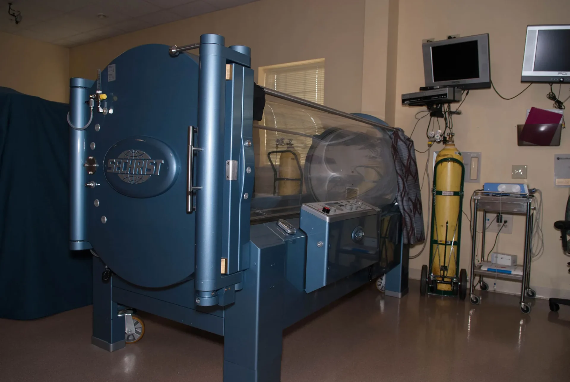 Hyperbaric oxygen therapy chamber in a medical treatment room